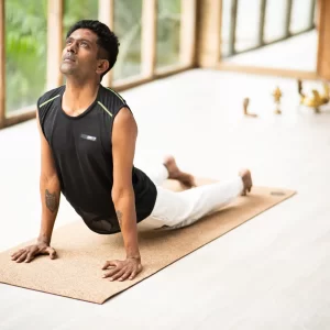 a-man-performing-juru-pro-yoga-mat-on-yoga-studio
